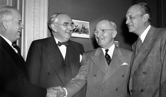 Sen. Kenneth Wherry (R-Neb.), Sen. Arthur Vandenberg (R-Mich.), President Truman and Sen. Scott Lucas (D-Ill.), left to right as they greeted the President at a luncheon marking his four years in office on April 12, 1949. (AP Photo) (Associated Press)