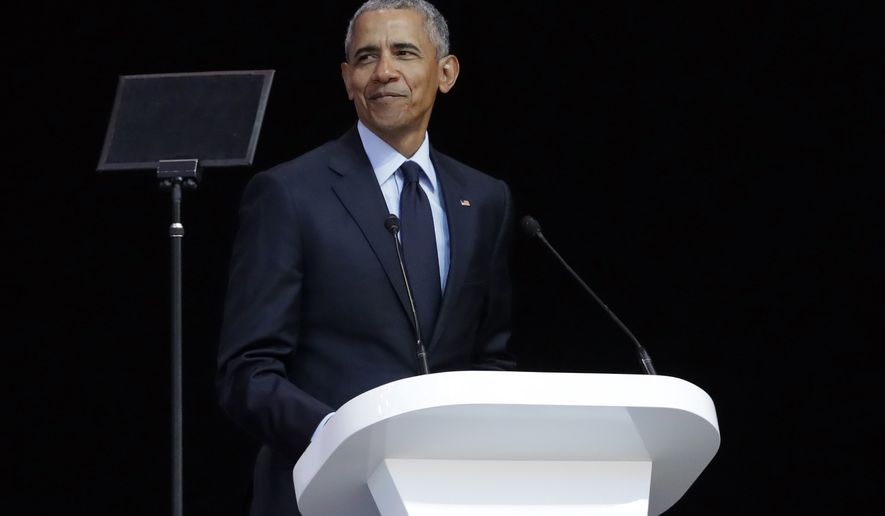 Former U.S. President Barack Obama, left, delivers his speech at the 16th Annual Nelson Mandela Lecture at the Wanderers Stadium in Johannesburg, South Africa, Tuesday, July 17, 2018. In his highest-profile speech since leaving office, Obama urged people around the world to respect human rights and other values under threat in an address marking the 100th anniversary of anti-apartheid leader Nelson Mandela&#39;s birth. (AP Photo/Themba Hadebe)