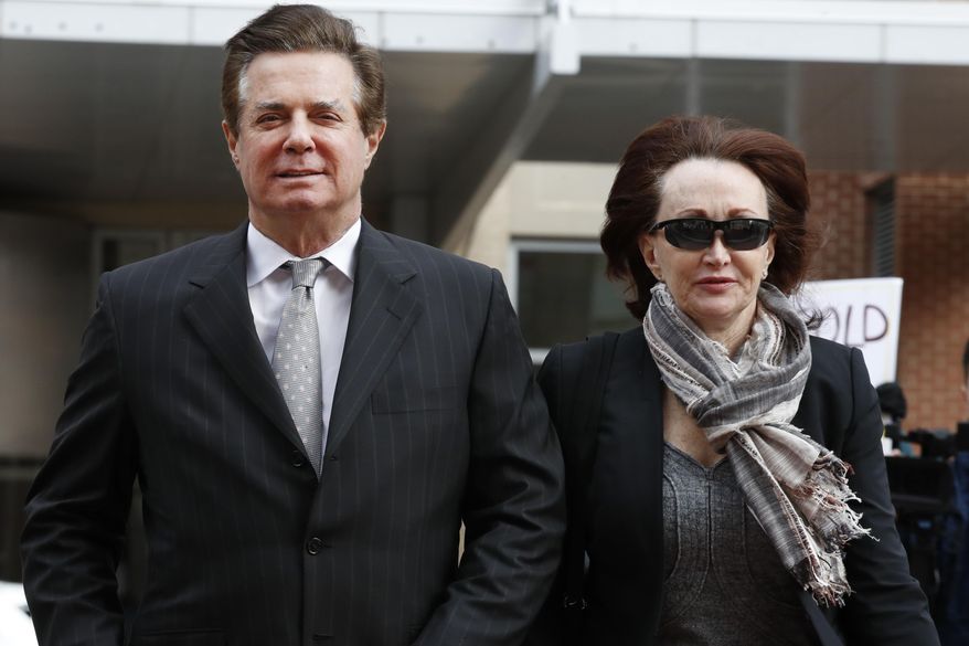 FILE - In this March 8, 2018, file photo, Paul Manafort, left, President Donald Trump's former campaign chairman, walks with this wife Kathleen Manafort, as they arrive at the Alexandria Federal Courthouse in Alexandria, Va. Special counsel Robert Mueller is seeking immunity for five potential witnesses in the upcoming trial of Manafort. Mueller's office told a federal judge in Virginia on July 17 that they were seeking to compel the witnesses to testify under condition of immunity. Prosecutors said the witnesses have indicated they won't testify "on the basis of their privilege against self-incrimination." Prosecutors say that if they do testify, they are requesting "use immunity." That means the government couldn't use their statements against them. (AP Photo/Jacquelyn Martin, File)