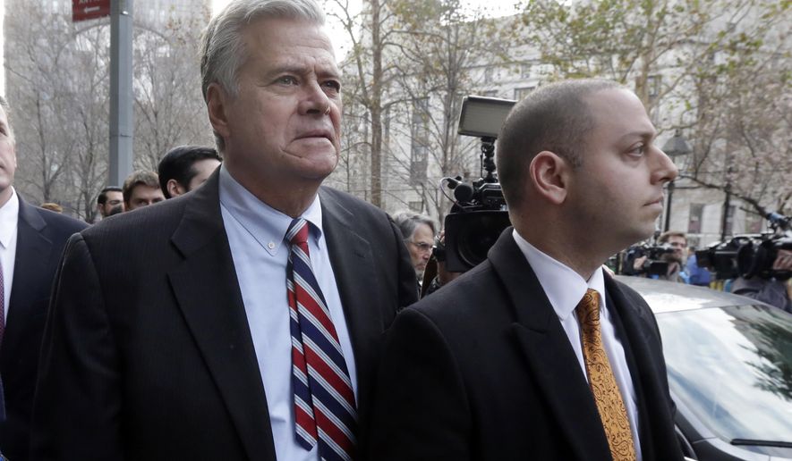 FILE - In this Dec. 11, 2015, file photo, former New York state Senate leader Dean Skelos, left, and his son Adam Skelos leave federal court, in New York. Skelos and his son have been convicted of bribery, wire fraud and extortion charges at their federal corruption trial on Tuesday, July 17, 2018. The two were accused of selling the once-powerful Republican&#x27;s office by pressuring wealthy businessmen into giving Adam Skelos roughly $300,000 for no-show jobs. (AP Photo/Richard Drew, File)