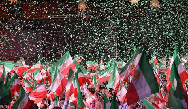 The National Council of Resistance of Iran, which has found new prominence in the Trump administration, rallied in Paris. (Sarah Wachter/Special to The Washington Times)