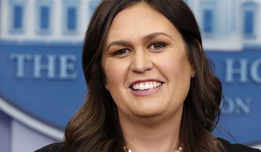 In this June 14, 2018, file photo, White House press secretary Sarah Huckabee Sanders smiles as she wishes President Donald Trump a happy birthday, during the daily briefing, in the Briefing Room of the White House in Washington. (AP Photo/Jacquelyn Martin, File)