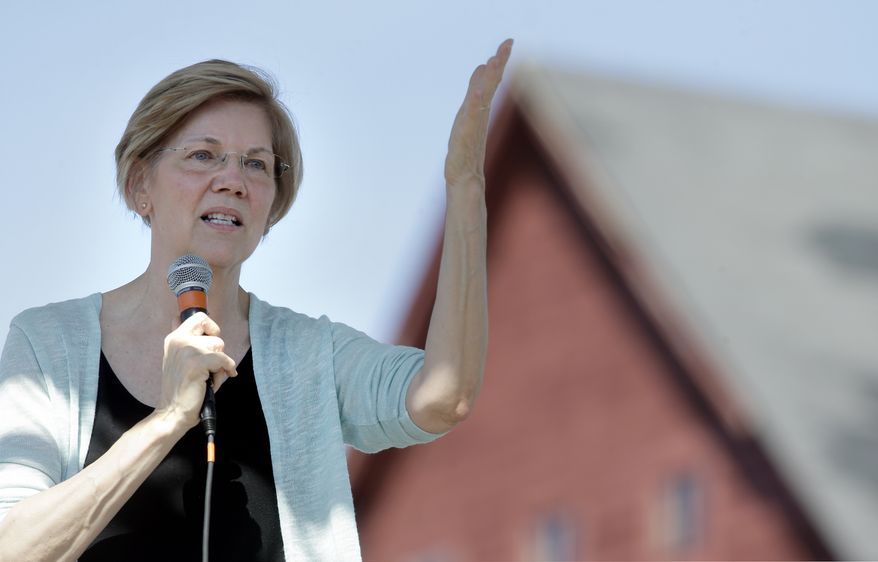 Sen. Elizabeth Warren, D-Mass., addresses an audience at Belkin Family Lookout Farm during a town hall event, Sunday, July 8, 2018, in Natick, Mass. Warren hosted the town hall and cookout following an Independence Day trip to visit U.S. troops in Iraq and Kuwait. (AP Photo/Steven Senne)