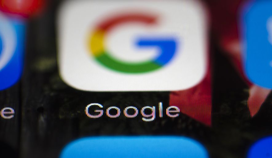 This Wednesday, April 26, 2017 file photo shows a Google icon on a mobile phone, in Philadelphia. European Union antitrust chief Margrethe Vestager is planning a statement on Wednesday, July 18, 2018 amid reports that her office will slap a record $5 billion fine on Google for abuse of its dominant position in the Android mobile phone operating systems. The decision was widely expected this week and financial media, including Bloomberg and the Financial Times, said the amount would total 4.3 billion euros. (AP Photo/Matt Rourke, File)