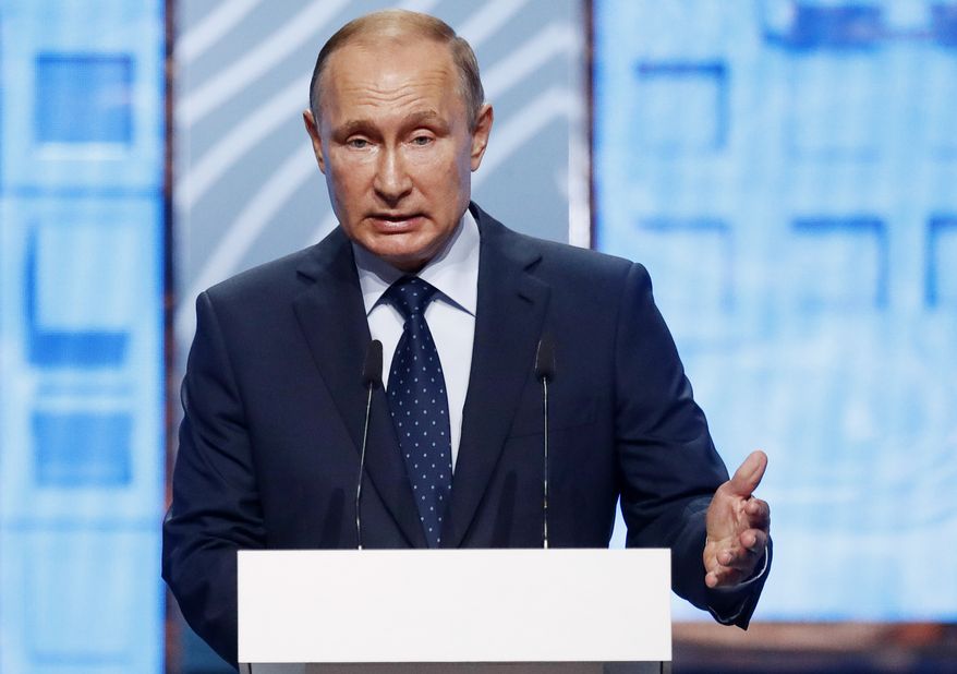Russian President Vladimir Putin addresses Moscow Urban Forum 2018, in Moscow, Russia, Wednesday, July 18, 2018. The forum focuses on a discussion of the results of large-scale urban transformations over the last decades, the plans for building cities of the future. (Sergei Karpukhin/Pool Photo via AP)
