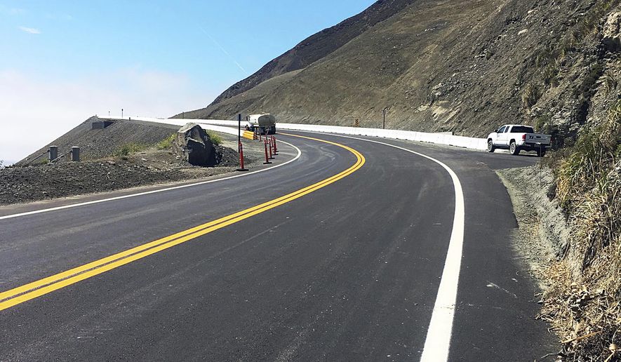 This photo provided by the California Department of Transportation (Caltrans) shows the stretch of Highway 1 that has been rebuilt and opened for traffic Wednesday morning, July 18, 2018, near Big Sur, Calif., on the California coast. The coastal road that links San Francisco and Los Angeles was blocked by a massive landslide in May, 2017 that moved millions of tons of earth, displacing 75 acres (30 hectares) of land. (Caltrans via AP)