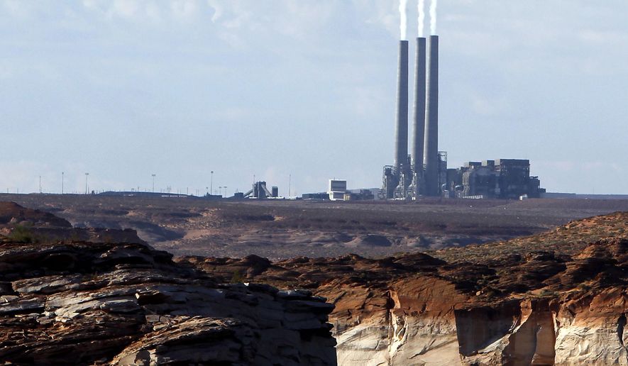 *FILE - This Sept. 4, 2011 file photo shows the main plant facility at the Navajo Generating Station northeast of Grand Canyon National Park as seen from Lake Powell in Page, Ariz. A new study concludes visitors may be steering clear of some U.S. national parks or cutting their visits short because of pollution. (AP Photo/Ross D. Franklin, File)