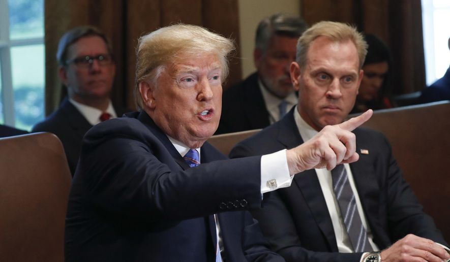 President Donald Trump gestures while speaking during his meeting with members of his cabinet in Cabinet Room of the White House in Washington, Wednesday, July 18, 2018. Looking on is Deputy Secretary of Defense Patrick Shanahan. (AP Photo/Pablo Martinez Monsivais) ** FILE **