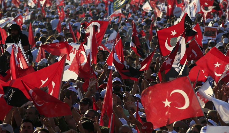 FILE - In this Sunday, July 9, 2017 file photo, supporters of Kemal Kilicdaroglu, the leader of Turkey&#39;s main opposition Republican People&#39;s Party, hold Turkish flags in Istanbul, as they gather for a rally following their 425-kilometer (265-mile) &#39;March for Justice&#39; from capital Ankara to Istanbul. Turkey declared a three-month state of emergency after a failed coup attempt in 2016, and has extended it seven times since then, but it is scheduled to end at midnight Wednesday July 18, 2018, though opposition leaders insists that new anti-terrorism laws are just as oppressive as the emergency powers they will replace. (AP Photo/Lefteris Pitarakis, File)