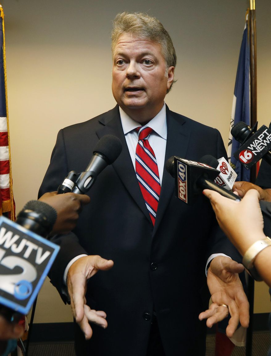 Mississippi Attorney General Jim Hood tells reporters, he has sent letters to more than 50 state officials asking them to preserve any records they might have related to a planned frontage road off Lakeland Drive from Lt. Gov. Tate Reeves' neighborhood to a nearby traffic light at a shopping center in Flowood, Thursday, July 19, 2018, following an unrelated news conference in Jackson, Miss. (AP Photo/Rogelio V. Solis)