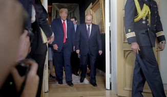 U.S. President Donald Trump, left, and Russian President Vladimir Putin, right, arrive for a one-on-one-meeting at the Presidential Palace in Helsinki, Finland, Monday, July 16, 2018. (AP Photo/Pablo Martinez Monsivais)