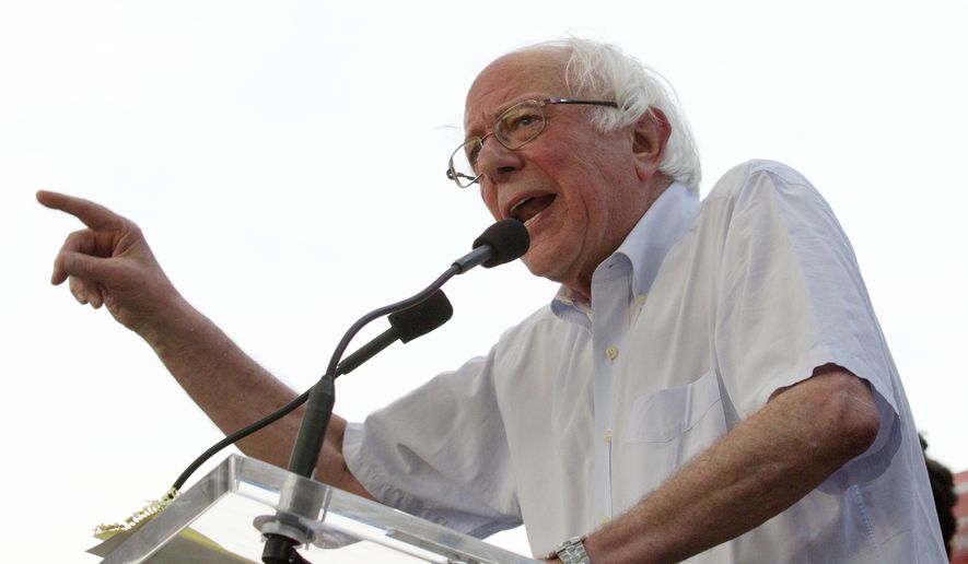 In this June 18, 2018, file photo, Sen. Bernie Sanders, I-Vt., accompanied by Democrat Ben Jealous, speaks to the crowd during a gubernatorial campaign rally in Maryland&#x27;s Democratic primary at downtown Silver Spring, Md. Sanders and Alexandria Ocasio-Cortez are campaigning in solidly Republican Kansas as they take their liberal message to an unlikely testing ground before next month’s congressional primaries. (AP Photo/Jose Luis Magana, File)