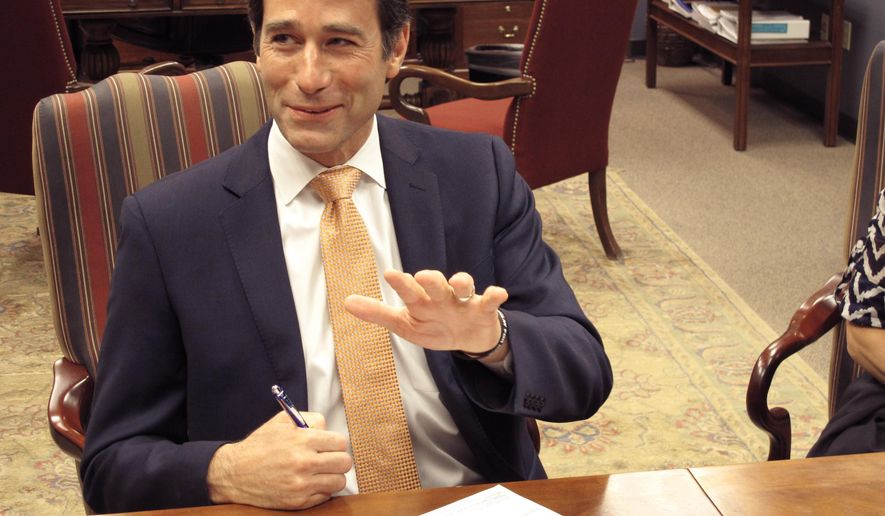 U.S. Rep. Garret Graves, R-Baton Rouge, talks at the secretary of state's office as he qualified for his congressional re-election bid, on Friday, July 20, 2018, in Baton Rouge, La. Friday was the last day of the sign-up period for the Nov. 6 ballot. (AP Photo/Melinda Deslatte)