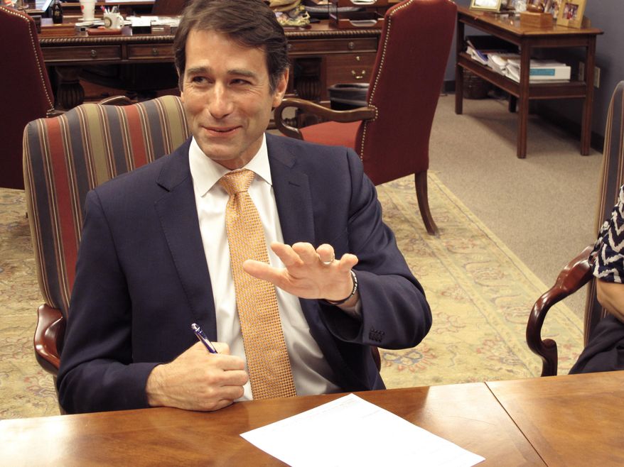 U.S. Rep. Garret Graves, R-Baton Rouge, talks at the secretary of state's office as he qualified for his congressional re-election bid, on Friday, July 20, 2018, in Baton Rouge, La. Friday was the last day of the sign-up period for the Nov. 6 ballot. (AP Photo/Melinda Deslatte)