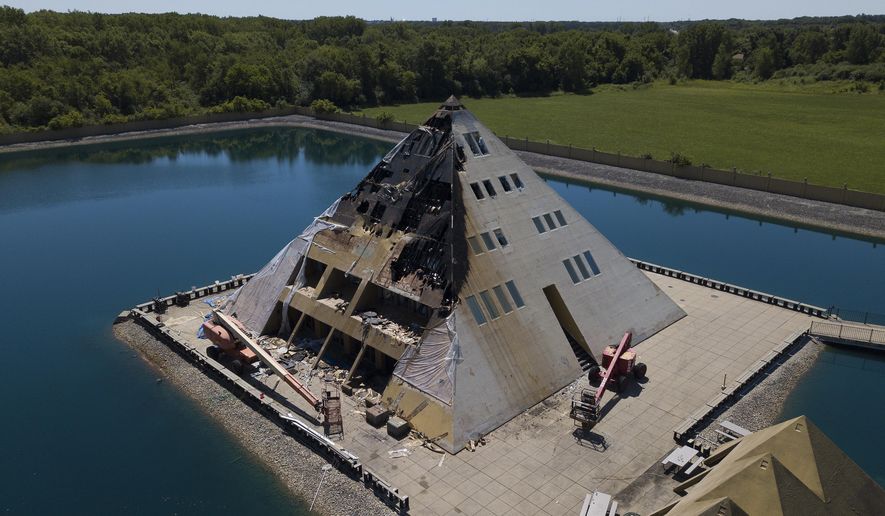 This aerial photo shows fire damage to the Golf Pyramid House Wednesday, July 18, 2018,  in Wadsworth, Ill. Fire officials say no people were hurt but a dog died in the Tuesday fire. The Gold Pyramid House was built in 1977 as a private residence but has since opened for public tours. (Mark Welsh/Daily Herald via AP)