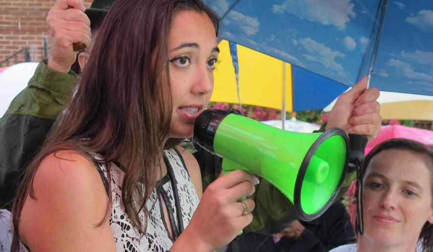 Reporter Selene San Felice, who survived the June 28 shooting at the Capital-Gazette newspaper that killed five of her colleagues, rallies for stronger gun-control legislation on Saturday, July 21, 2018 in Annapolis, Md. Felice says "we need a government that stands up for us."(AP Photo/Brian Witte)