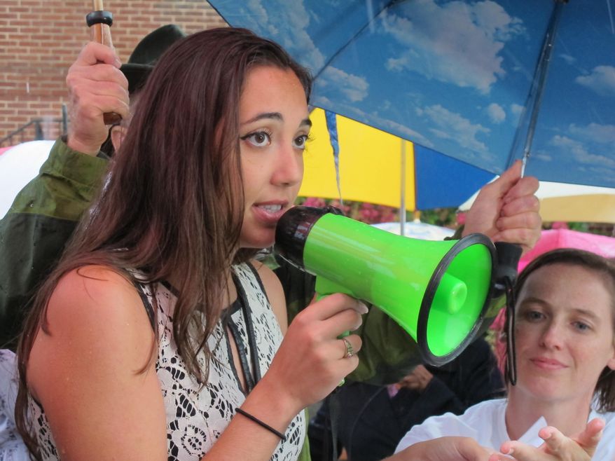 Reporter Selene San Felice, who survived the June 28 shooting at the Capital-Gazette newspaper that killed five of her colleagues, rallies for stronger gun-control legislation on Saturday, July 21, 2018 in Annapolis, Md. Felice says "we need a government that stands up for us."(AP Photo/Brian Witte)