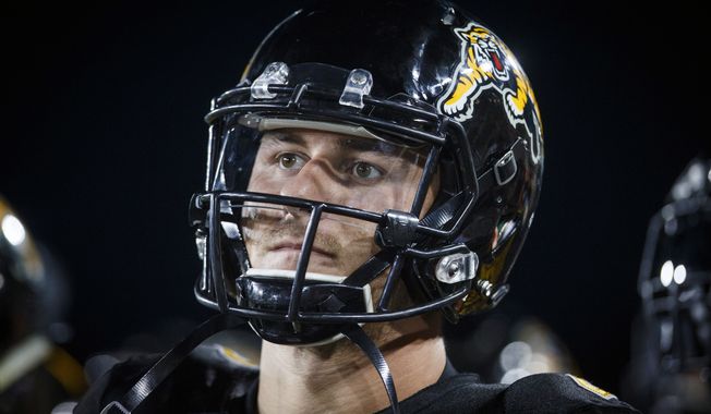 FILE - In this Thursday, July 19, 2018, file photo, Hamilton Tiger-Cats quarterback Johnny Manziel looks on from the sideline during second-half CFL football game action against the Saskatchewan Roughriders in Hamilton, Ontario. Manziel is headed to the Montreal Alouettes. Montreal acquired the former Heisman Trophy winner and offensive linemen Tony Washington and Landon Rice from the Hamilton Tiger-Cats for defensive end Jamaal Westerman, wide receiver Chris Williams and first-round draft picks in 2020 and 2021. (Mark Blinch/The Canadian Press via AP, File)