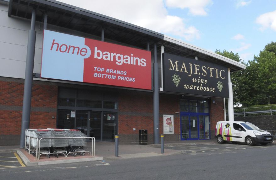 A general view of the Home Bargains store where a man is accused of an acid attack on a young boy, in Worcester, England, Sunday, July 22, 2018. British police say a 3-year-old boy suffered severe burns on his face and arm during a suspected acid attack that investigators think was deliberate. West Mercia police Chief Superintendent Mark Travis said police are working to identify the substance that burned the child on Saturday at a discount store in Worcester, England. (Matthew Cooper/PA via AP)