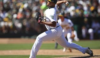 Oakland Athletics pitcher Jeurys Familia works against the San Francisco Giants in the ninth inning of a baseball game Sunday, July 22, 2018, in Oakland, Calif. (AP Photo/Ben Margot)