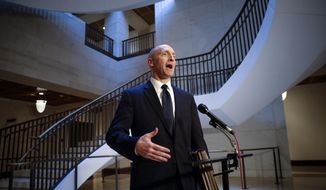 Carter Page, a foreign policy adviser to Donald Trump&#39;s 2016 presidential campaign, speaks with reporters following a day of questions from the House Intelligence Committee, on Capitol Hill in Washington. (AP Photo/J. Scott Applewhite, File)