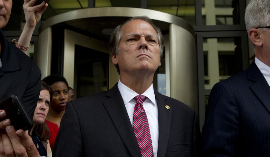 James Wolfe former director of security with the Senate Intelligence Committee leaves the federal courthouse, Wednesday, June 13, 2018, in Washington. James Wolfe a former director of security of the Senate Intelligence Committee was indicted for allegedly lying to FBI agents in December last year about repeated contacts with three reporters, which included the use of encrypted messaging applications. (AP Photo/Jose Luis Magana)