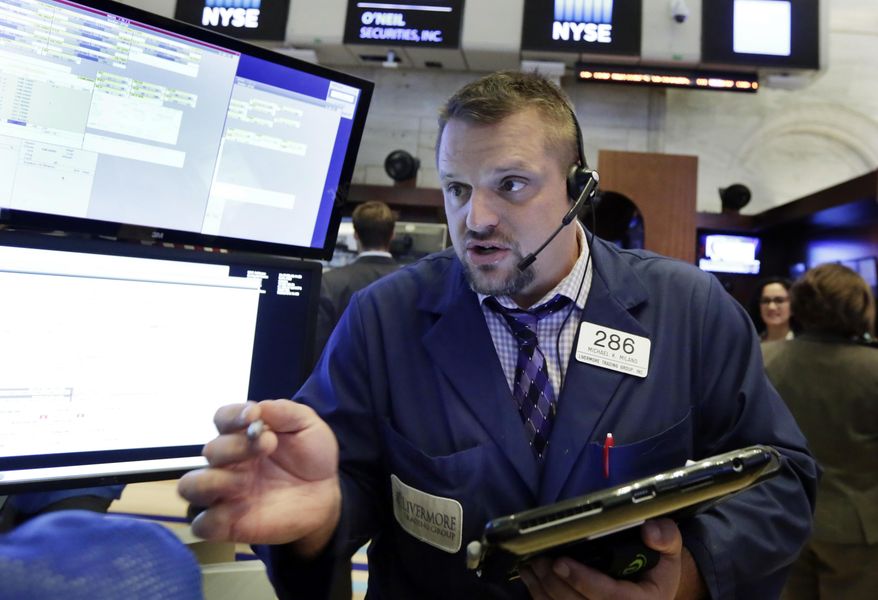 Trader Michael Milano works on the floor of the New York Stock Exchange, Monday, July 23, 2018. Stocks are opening slightly lower on Wall Street, led by declines in technology companies and retailers. (AP Photo/Richard Drew)