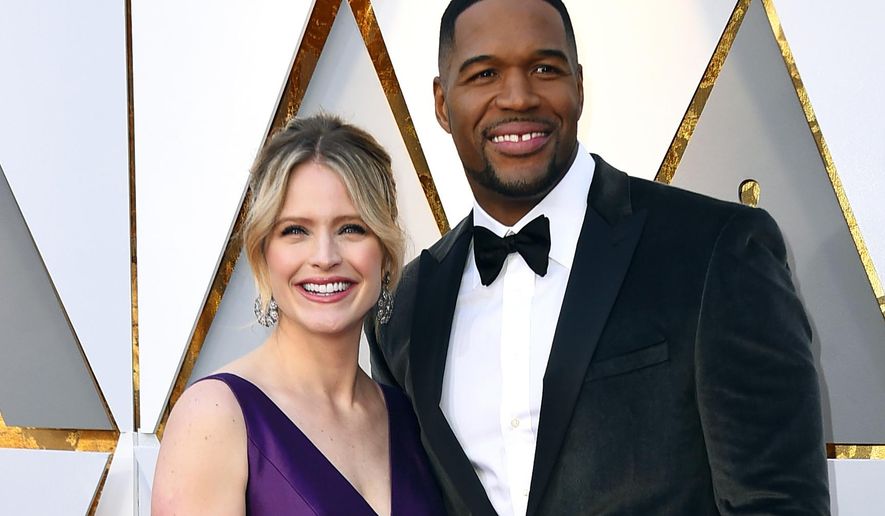 FILE - In this March 4, 2018 file photo, Sara Haines, left, and Michael Strahan arrive at the Oscars in Los Angeles. ABC News announced Monday, July 23, 2018, that Strahan and Haines will co-host “GMA Day.” The show is set to premiere at 1 p.m. EDT on Sept. 10. (Photo by Jordan Strauss/Invision/AP, File)