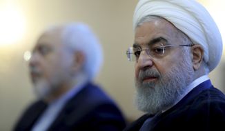 In this photo released by official website of the office of the Iranian Presidency, President Hassan Rouhani attends a meeting with a group of foreign ministry officials in Tehran, Iran, Sunday, July 22, 2018. Rouhani warned President Donald Trump against provoking his country while indicating peace between the two nations might still be possible. (Iranian Presidency Office via AP) **FILE**