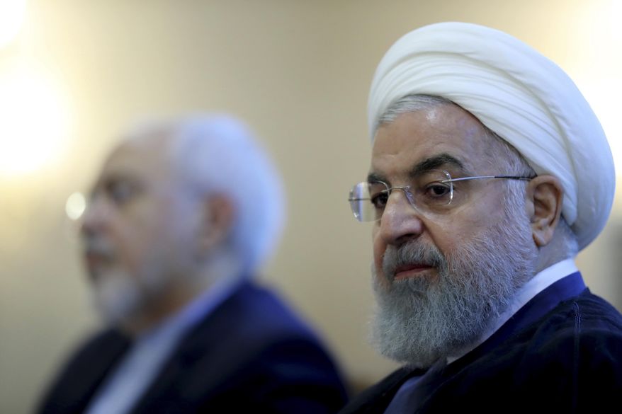 In this photo released by official website of the office of the Iranian Presidency, President Hassan Rouhani attends a meeting with a group of foreign ministry officials in Tehran, Iran, Sunday, July 22, 2018. Rouhani warned President Donald Trump against provoking his country while indicating peace between the two nations might still be possible. (Iranian Presidency Office via AP) **FILE**