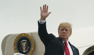 President Donald Trump waves as he boards Air Force One at Morristown Municipal Airport, in Morristown, N.J., Sunday, July 22, 2018, en route to Washington after staying at Trump National Golf Club in Bedminster, N.J. (AP Photo/Carolyn Kaster)