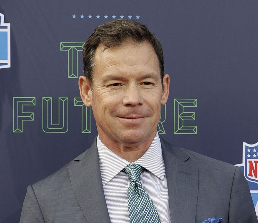 FILE - In this April 26, 2018, file photo, Jim Mora poses for photos on the red carpet before the first round of the 2018 NFL football draft, in Arlington, Texas. Former UCLA coach Jim Mora is joining ESPN as a college football analyst. He will fill the role Chip Kelly held last season before replacing Mora with the Bruins. (AP Photo/Eric Gay, File)