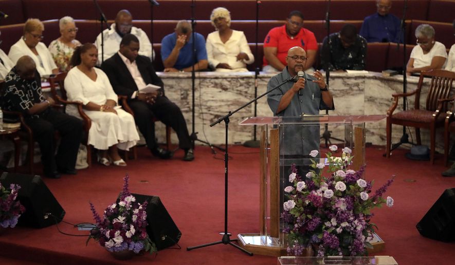 The Rev. Melvin Johnson prays during a prayer vigil, Monday, July 23, 2018, in Indianapolis. The vigil was held for the Coleman family and other families who lost family members in the duck boat accident at Table Rock Lake near Branson, Mo. (AP Photo/Darron Cummings)