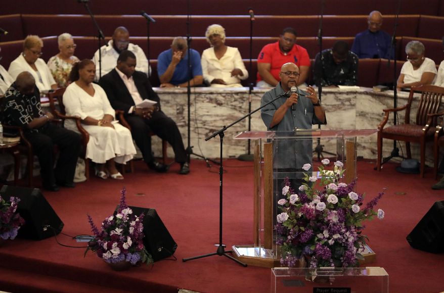 The Rev. Melvin Johnson prays during a prayer vigil, Monday, July 23, 2018, in Indianapolis. The vigil was held for the Coleman family and other families who lost family members in the duck boat accident at Table Rock Lake near Branson, Mo. (AP Photo/Darron Cummings)