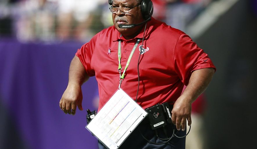 FILE - In this Oct. 9, 2016, file photo, Houston Texans defensive coordinator Romeo Crennel watches his team play the Minnesota Vikings during an NFL football game in Minneapolis. Crennel is back as defensive coordinator in Houston, replacing new Titans coach Mike Vrabel. (Jeff Haynes/AP Photo, File)