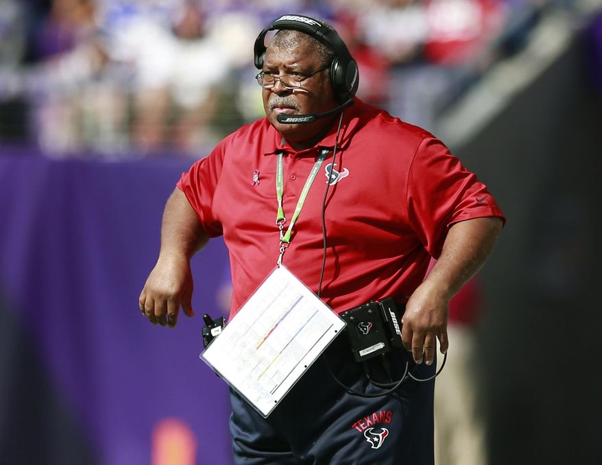 FILE - In this Oct. 9, 2016, file photo, Houston Texans defensive coordinator Romeo Crennel watches his team play the Minnesota Vikings during an NFL football game in Minneapolis. Crennel is back as defensive coordinator in Houston, replacing new Titans coach Mike Vrabel. (Jeff Haynes/AP Photo, File)