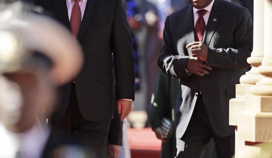 President Xi Jinping of China, left, alongside South African President Cyril Ramaphosa, during an official welcoming ceremony at the government's Union Buildings, in Pretoria, South Africa, Tuesday, July 24, 2018. Jinping is in the country to attend the three-day BRICS Summit starting Wednesday in Johannesburg. (AP Photo/Themba Hadebe)