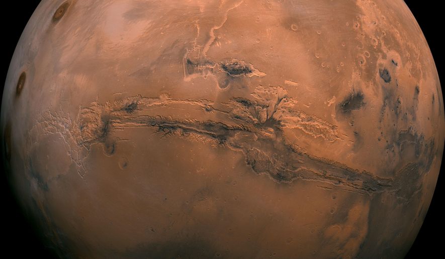 FILE - This image made available by NASA shows the planet Mars. This composite photo was created from over 100 images of Mars taken by Viking Orbiters in the 1970s. On Tuesday, July 31, 2018, the red planet will make its closest approach to Earth in 15 years. (NASA via AP)