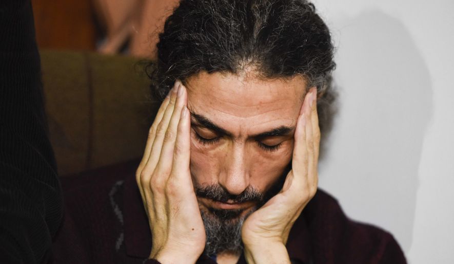 FILE - In this Sept. 30, 2016 file photo, former Guantanamo detainee Syrian Abu Wa'el Dhiab listens to a question as he holds a press conference at his apartment in Montevideo, Uruguay. Dhiab, who has been unhappy with resettlement in Uruguay, has once again left the South American nation. The Uruguayan government liaison for six resettled ex-prisoners said Tuesday, July 24, 2018, that Dhiab went to Turkey in late June, but that it’s unclear if the Syrian native is still in Turkey or if he was deported. (AP Photo/Matilde Campodonico, File)
