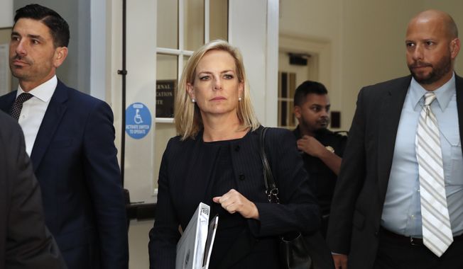 Homeland Security Secretary Kirstjen Nielsen, center, arrives for a closed doors meeting with the Congressional Hispanic Caucus, Wednesday, July 25, 2018, on Capitol Hill in Washington. (AP Photo/Jacquelyn Martin)