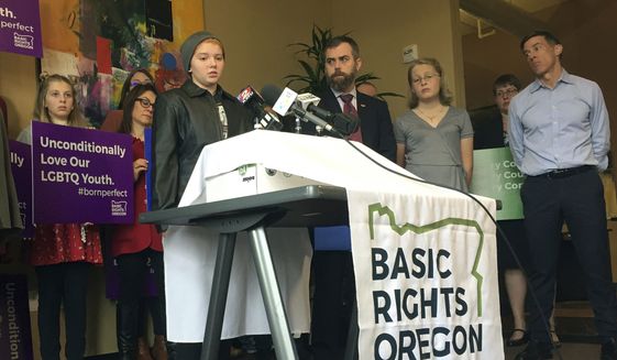 Elliot Yoder, 16, a transgender student at Dallas High School in Dallas, Ore., speaks at a news conference held by ACLU Oregon and Basic Rights in Portland, Ore., to protest a federal lawsuit filed against the Dallas School District over its policy on the treatment of transgender students, in this Nov. 16, 2017, photo. (AP Photo/Gillian Flaccus) **FILE**