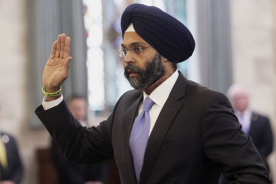 In this Jan. 16, 2018, file photo, Gurbir Grewal is sworn in before testifying in front of the senate judiciary committee in Trenton, N.J. WKXW-FM radio hosts Dennis Malloy and Judi Franco are receiving heavy criticism for repeatedly referring to Grewal, the state's attorney general, as "turban man" on air, Wednesday, July 25, The Record reports. (Chris Pedota/The Record via AP, File)