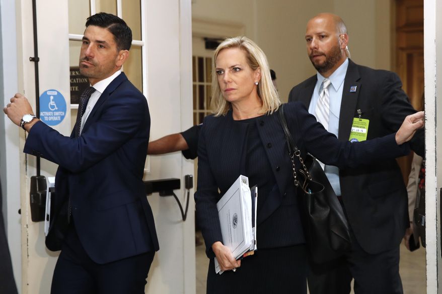 Homeland Security Secretary Kirstjen Nielsen, center, arrives for a closed doors meeting with the Congressional Hispanic Caucus, Wednesday, July 25, 2018, on Capitol Hill in Washington. (AP Photo/Jacquelyn Martin)