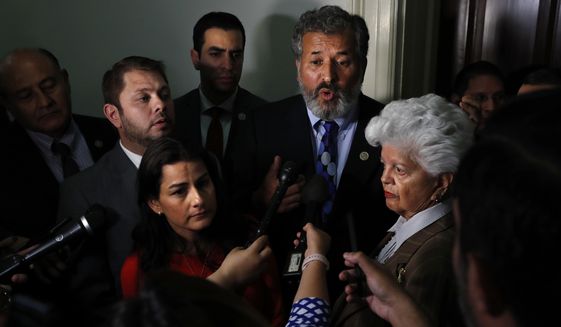 Rep. Juan Vargas, D-Calif., center, speaks about the Congressional Hispanic Caucus&#39; meeting with Homeland Security Secretary Kirstjen Nielsen, Wednesday, July 25, 2018, on Capitol Hill in Washington. Clockwise from Vargas are Rep. Grace Napolitano, D-Calif., Rep. Nanette Barragan, D-Calif., Rep. Ruben Gallego, D-Az., Rep. Lou Correa, D-Calif., back left, and Rep. Ruben Kihuen, D-Nevada. (AP Photo/Jacquelyn Martin)