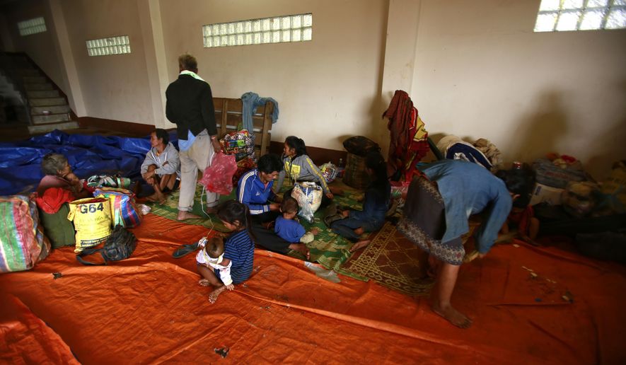 Villagers take refuge at a shelter in Paksong town, Champasak province, Laos on Wednesday, Jul. 25, 2018. Rescuers were searching Wednesday for villagers left missing when part of a newly built dam broke in southeastern Laos, flooding the surrounding countryside and killing at least 19 people. (AP Photo/Hau Dinh)