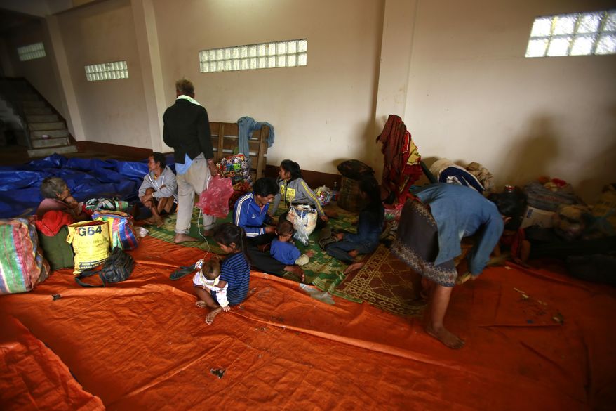 Villagers take refuge at a shelter in Paksong town, Champasak province, Laos on Wednesday, Jul. 25, 2018. Rescuers were searching Wednesday for villagers left missing when part of a newly built dam broke in southeastern Laos, flooding the surrounding countryside and killing at least 19 people. (AP Photo/Hau Dinh)