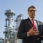 Secretary of Energy Rick Perry, with the main cyrogenic heating exchange behind him, speaks with reporters at Dominion Energy&#39;s Cove Point LNG liquefaction Project facility in Lusby, Md., Thursday, July 26, 2018. The completion of the facilities export expansion project makes it just the second LNG export facility in the U.S. (AP Photo/Cliff Owen)