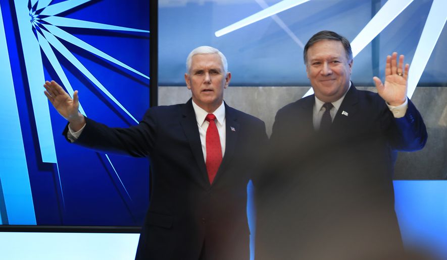 Vice President Mike Pence and Secretary of State Mike Pompeo, right, wave following a speech by Pence at the close of a three-day conference on religious freedom at the State Department in Washington, Thursday, July 26, 2018, as the Trump administration comes under criticism for strict refugee and migration policies that have sharply reduced America&#39;s intake of people fleeing persecution over their beliefs. (AP Photo/Manuel Balce Ceneta)