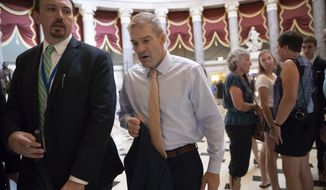 Rep. Jim Jordan, R-Ohio, walks to the House chamber as he prepares to file articles of impeachment against Deputy Attorney General Rod J. Rosenstein, on Capitol Hill in Washington, Thursday, July 26, 2018. (AP Photo/J. Scott Applewhite)