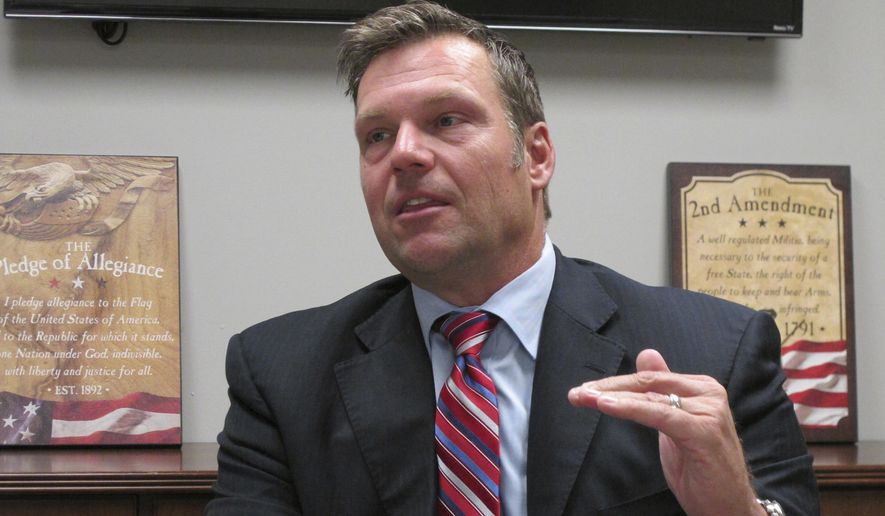 In this Oct. 16, 2017, file photo, Kansas Secretary of State Kris Kobach answers questions about his run for the Republican nomination for governor during an interview at the Johnson County Republican Party&#39;s headquarters in Overland Park, Kan. Attacks on Kobach by the American Civil Liberties Union in the Kansas governor&#39;s race are helping Kobach burnish his conservative credentials and giving him a useful message in his bid to unseat Gov. Jeff Colyer in the Republican primary. (AP Photo/John Hanna, File)